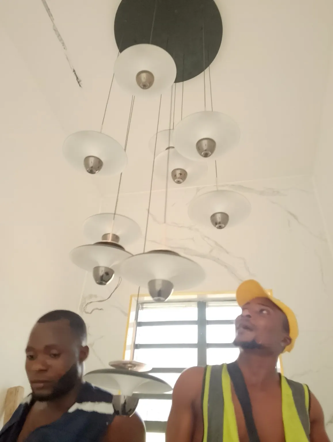 Electrician inspecting a residential electrical panel for safety faults